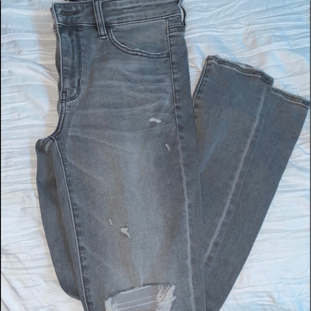 Grey jeans with holes